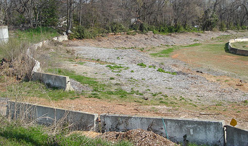 Weeds and rocky terrain now cover what once was the fourth turn at the old Piedmont Interstate Fairgrounds.